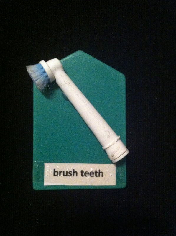 brush teeth label with top of toothbrush glued to card