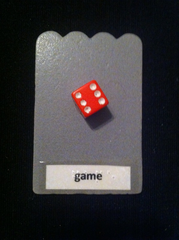 game label with dice glued to the card
