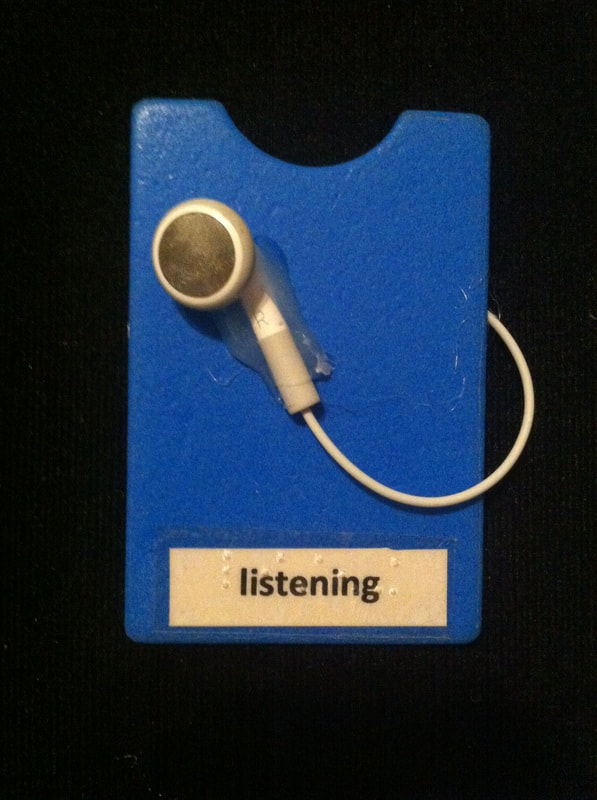 listening label with earbud glued to card
