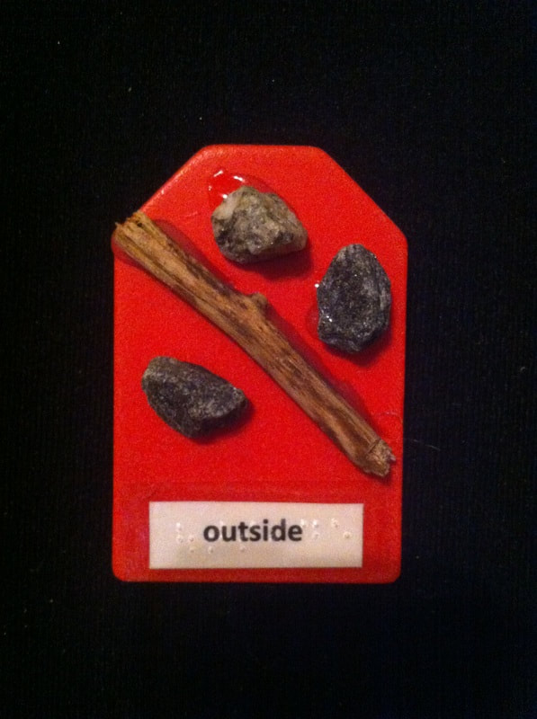outside label with rocks and stick glued to card