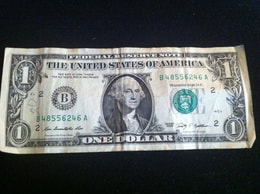 Picture of dollar bill unfolded.