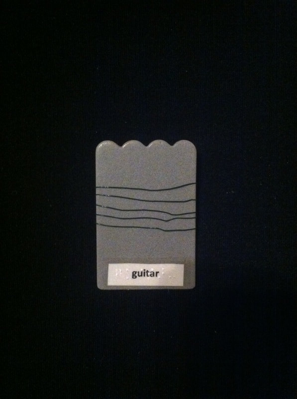 guitar label with wire wrapped around the card