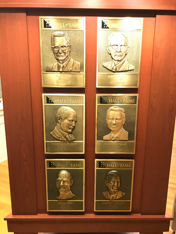 plaques of inductees Roy Kumpe, J. Max Woolly, William A. Hadley, Stanley Suterko, Newel Perry, and Michael T. Collins