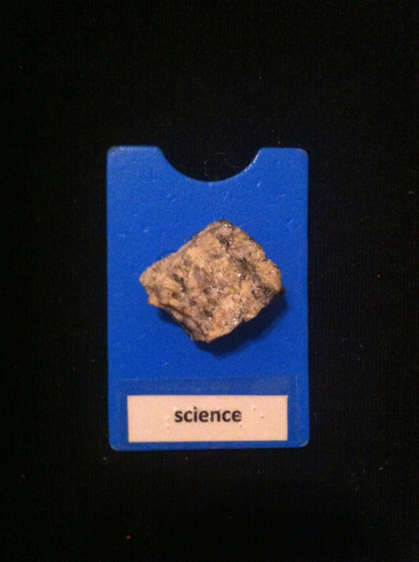 science label with rock glued to card